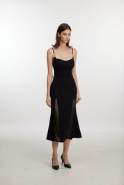 Black slip dress with side cutouts