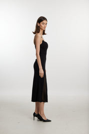 Black slip dress with side cutouts