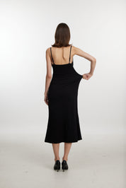 Black slip dress with side cutouts