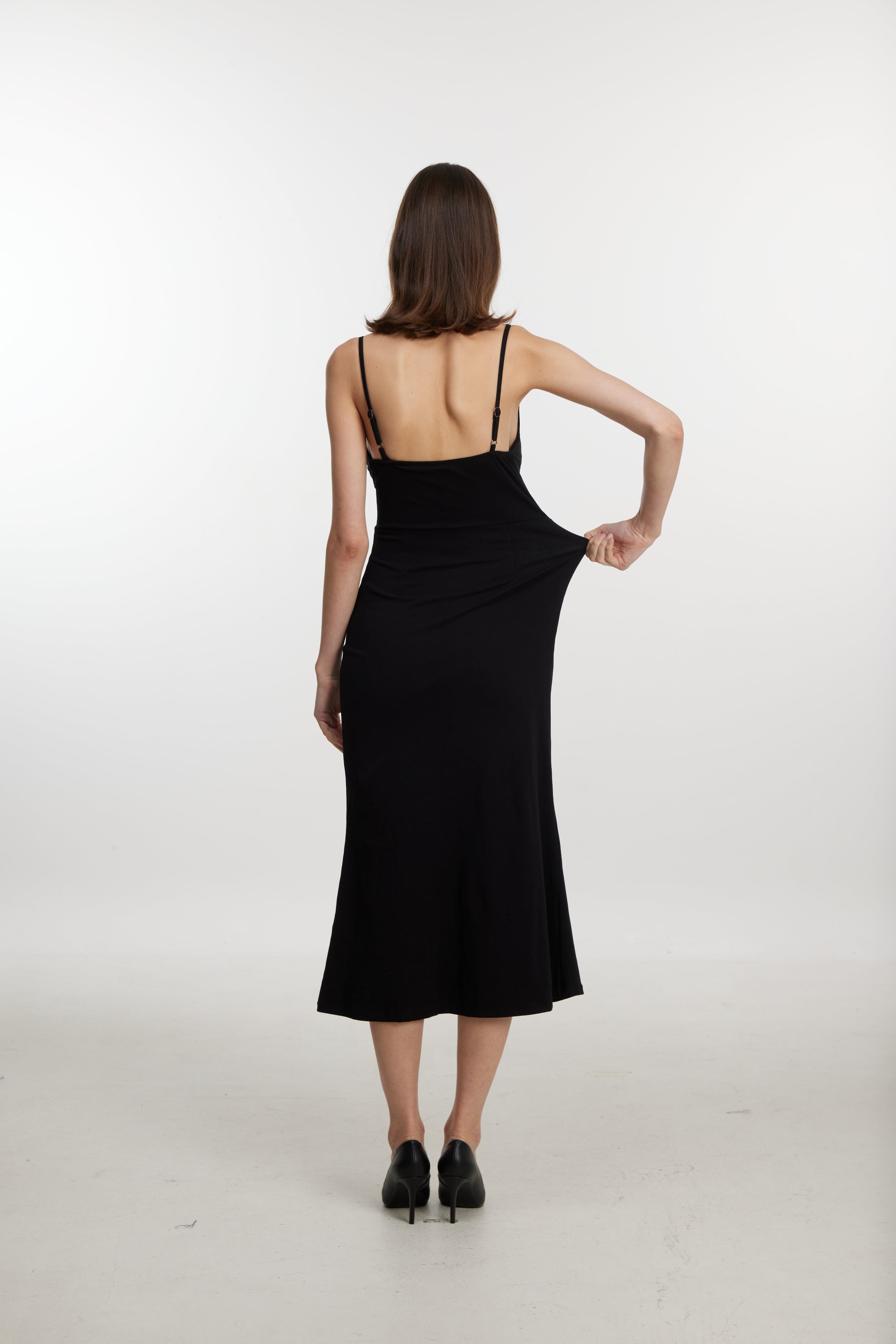 Black slip dress with side cutouts