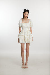 White ruffled mini dress with ruff sleeves