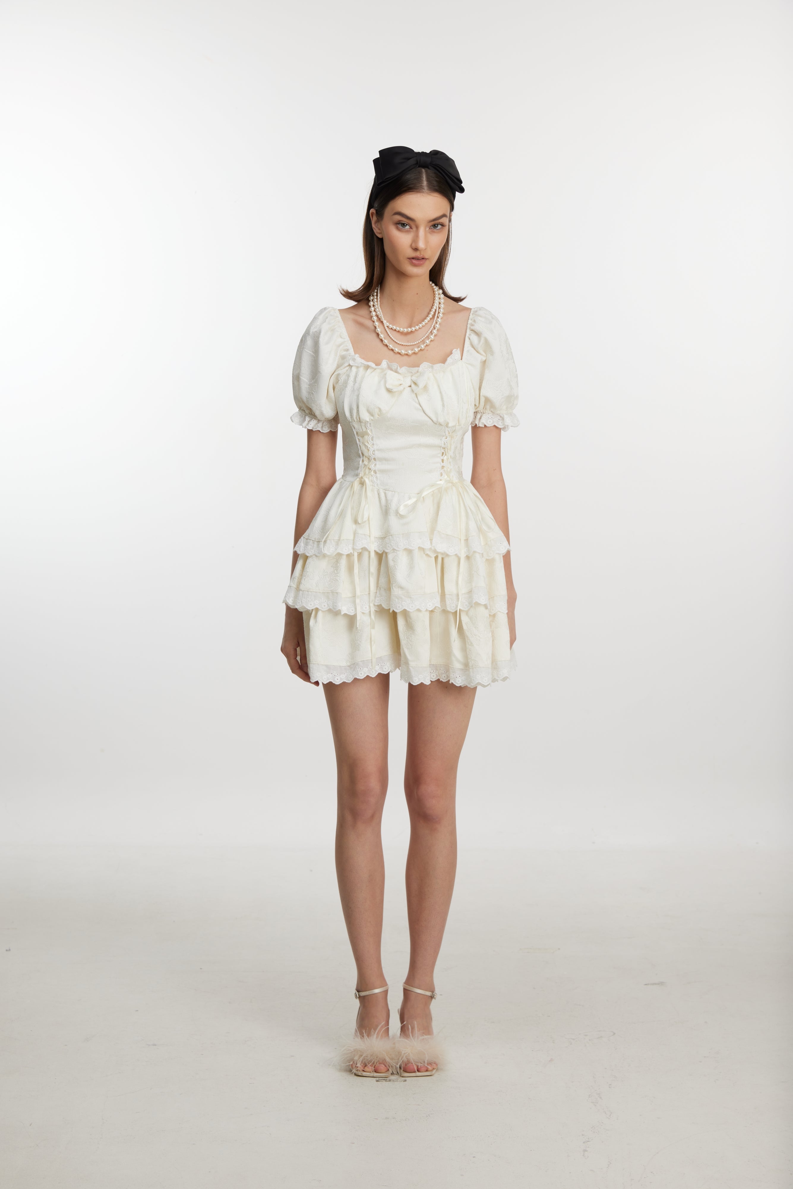 White ruffled mini dress with ruff sleeves