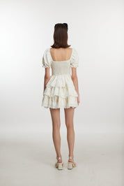 White ruffled mini dress with ruff sleeves