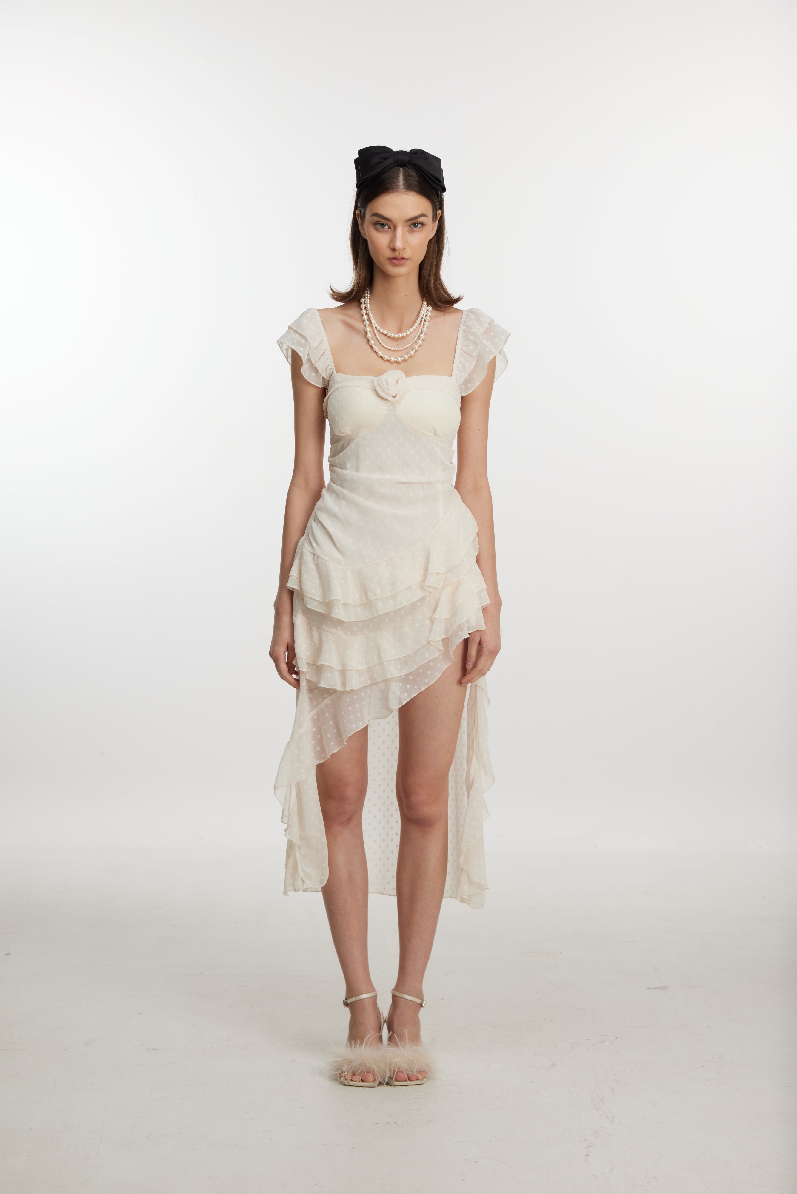 Chic white ruffle hem mini dress
