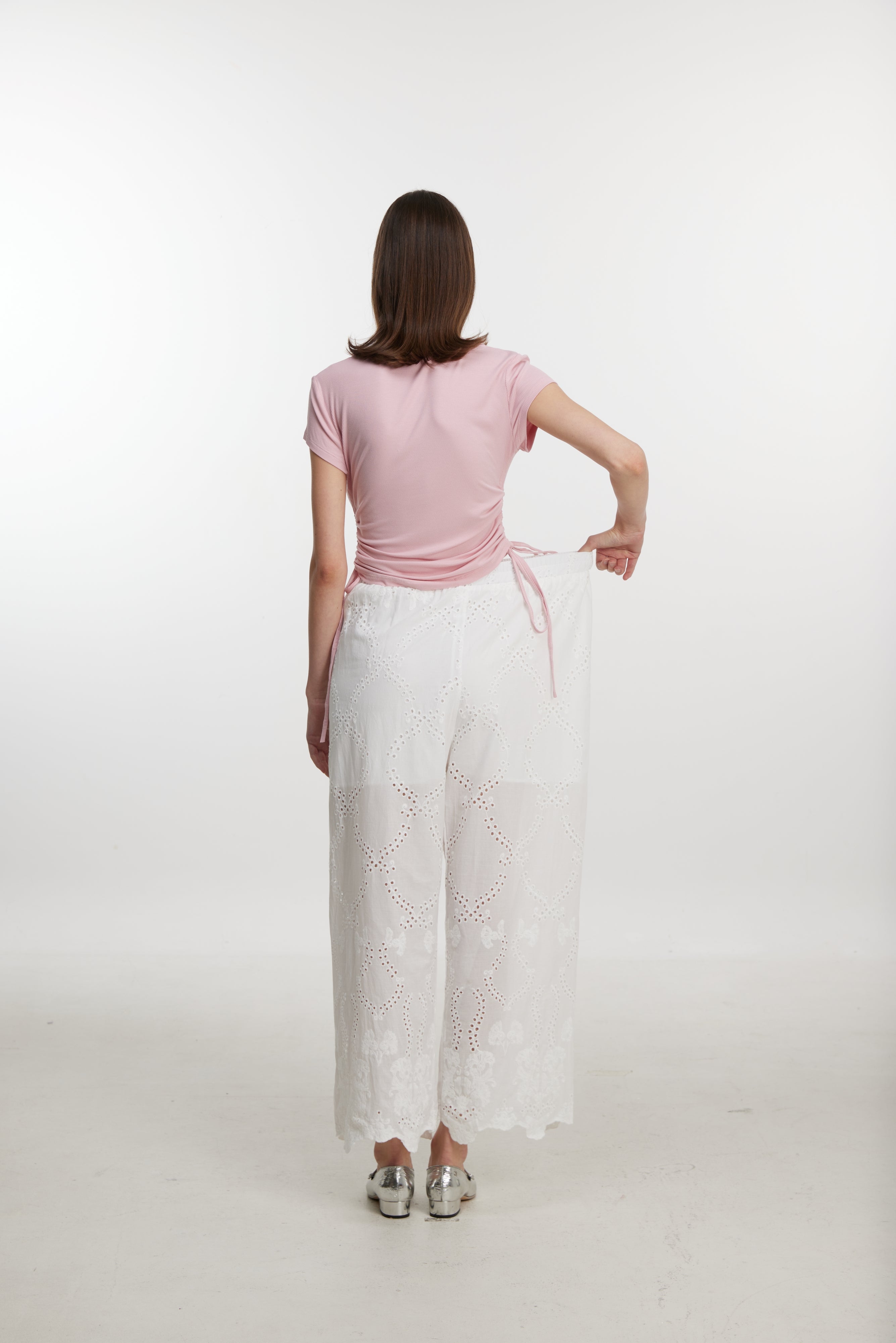 White lace-up trousers