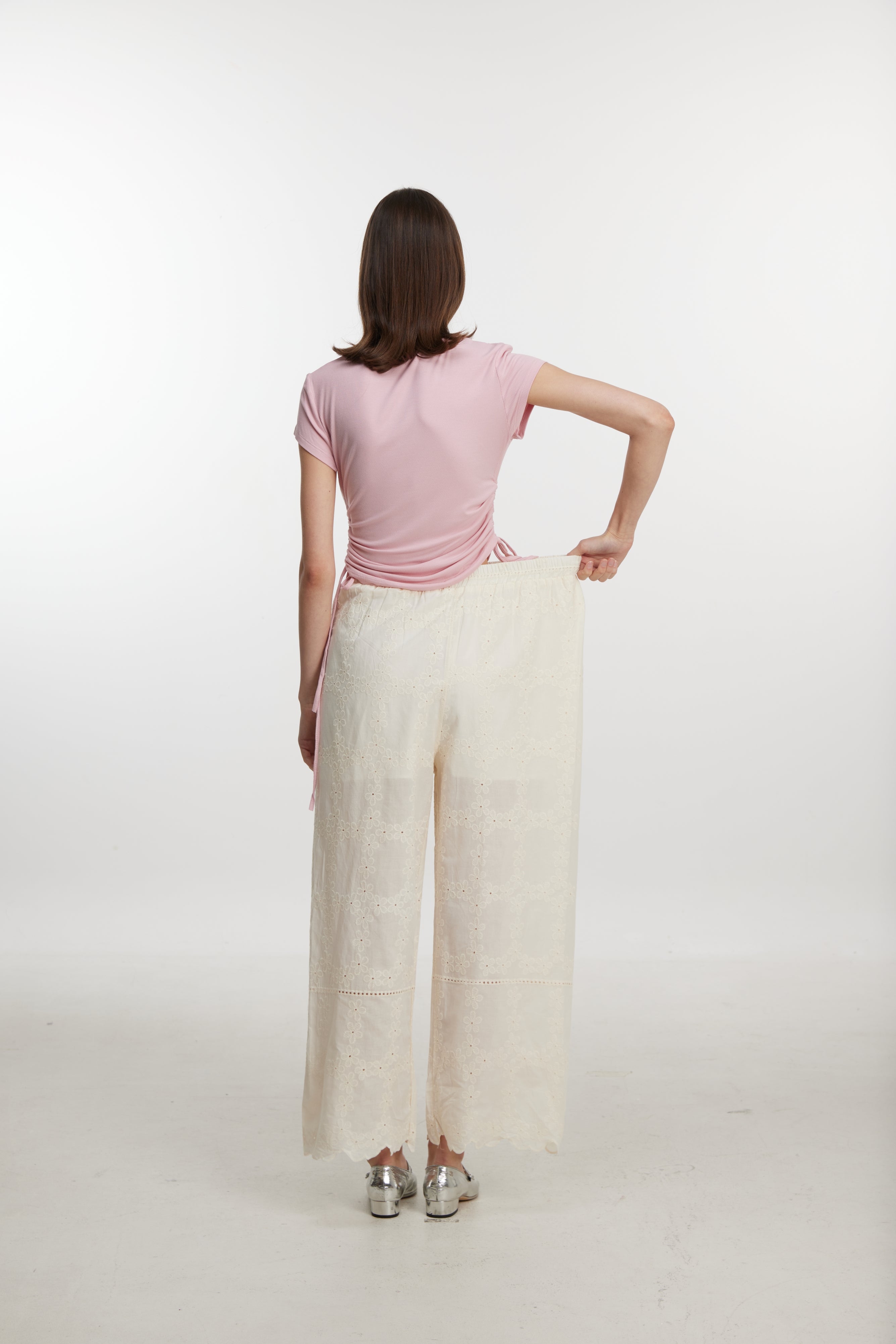 White lace-up trousers