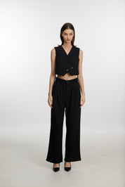 Stylish black ensemble with cropped vest and wide-leg pants